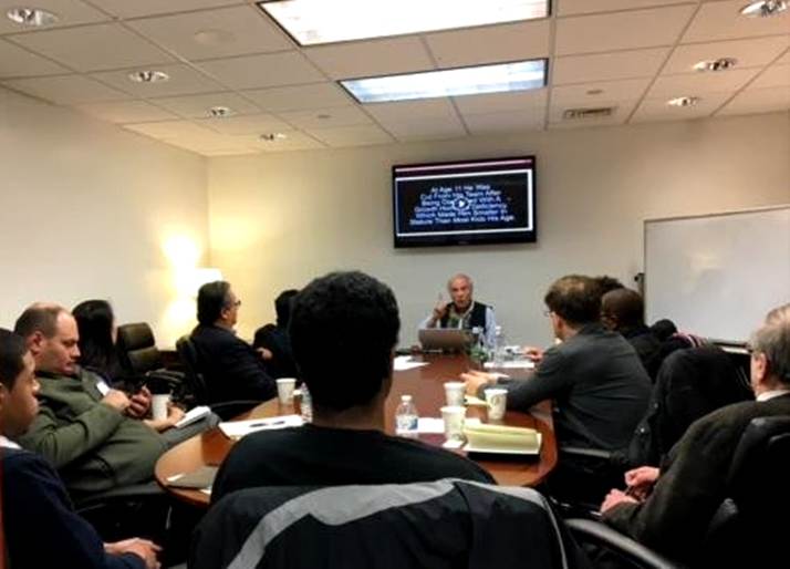 At a business seminar — discussing ideas and decisions.